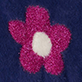Pink flower with a white center on a dark blue background