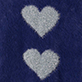 Two white hearts on a dark blue background