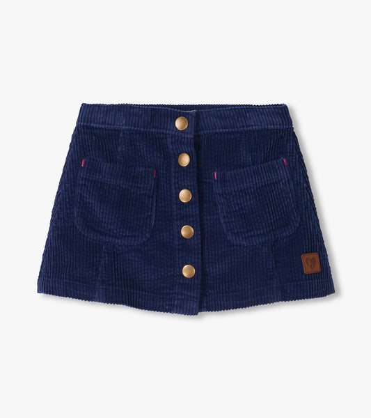 Patriot blue A-line skirt with front snap buttons, two front pockets, and a small patch near the hem