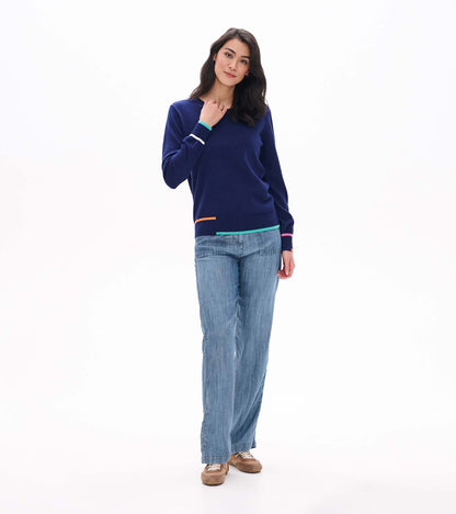 Full front view of patriot blue crew neck sweater styled with light wash wide leg jeans
