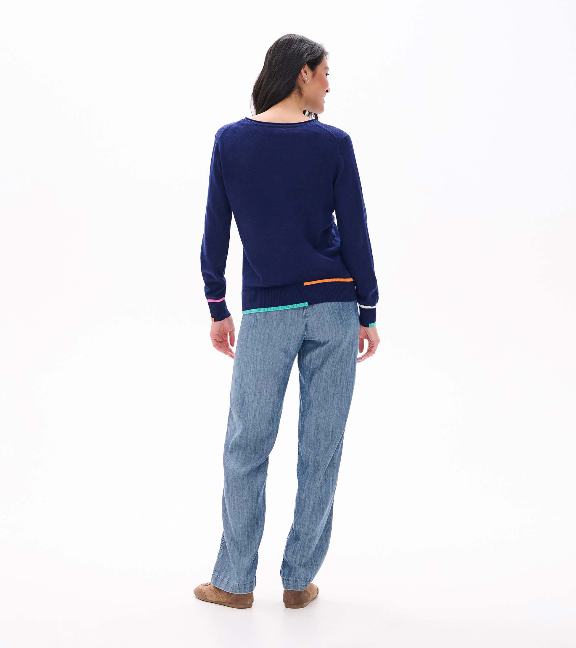 Back view of patriot blue crew neck sweater with colorful trim at the hem and cuffs