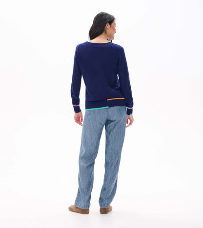 Back view of patriot blue crew neck sweater with colorful trim at the hem and cuffs