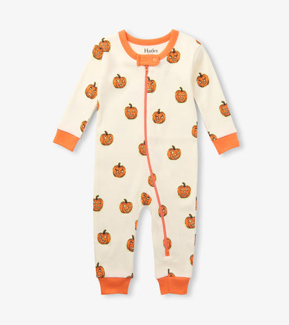 Front view of baby sleeper in cream with orange pumpkin print, orange cuffs, and full front zipper