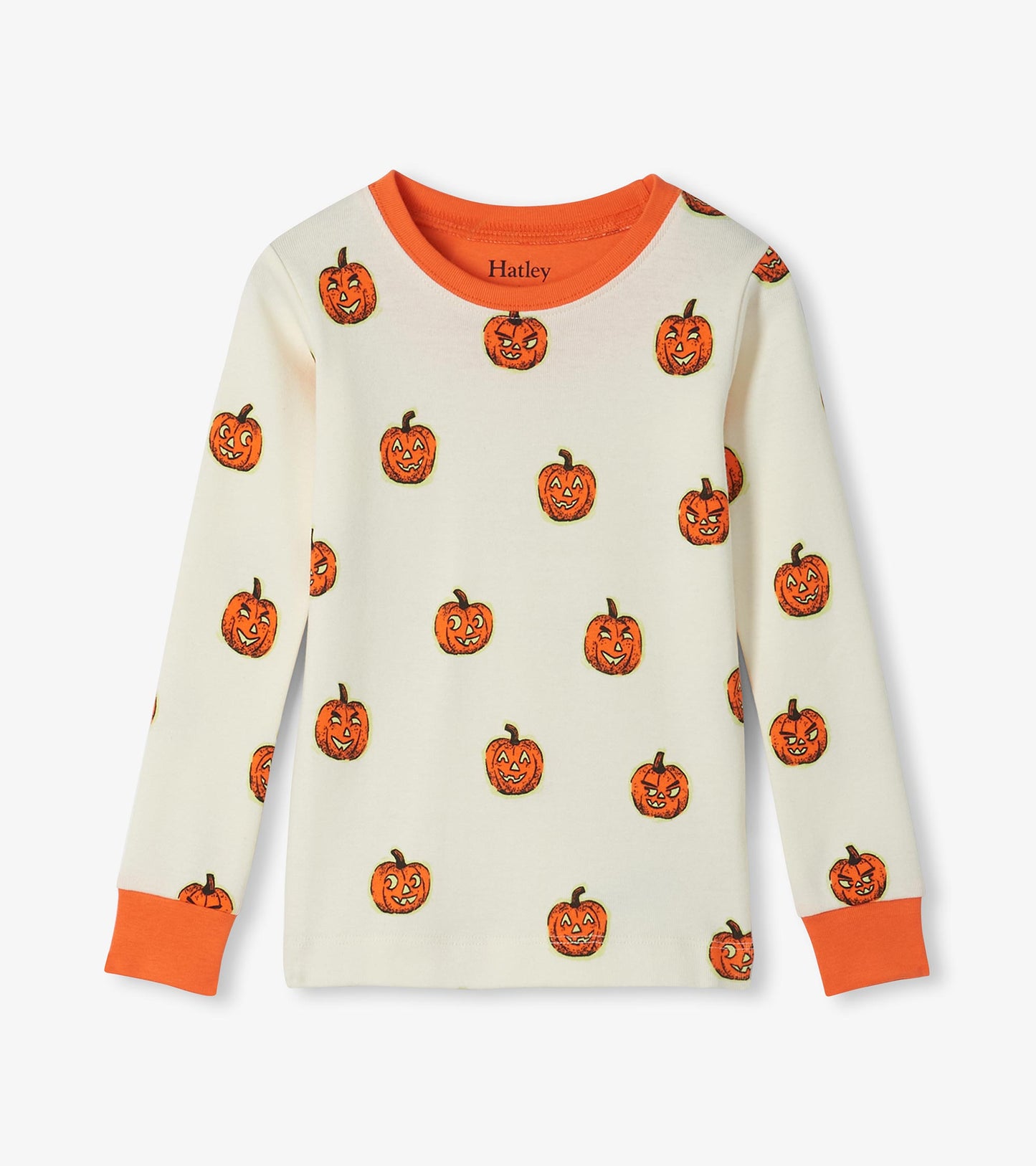 Kids pajama top in cream with orange jack-o'-lantern print and orange neck and sleeve cuffs