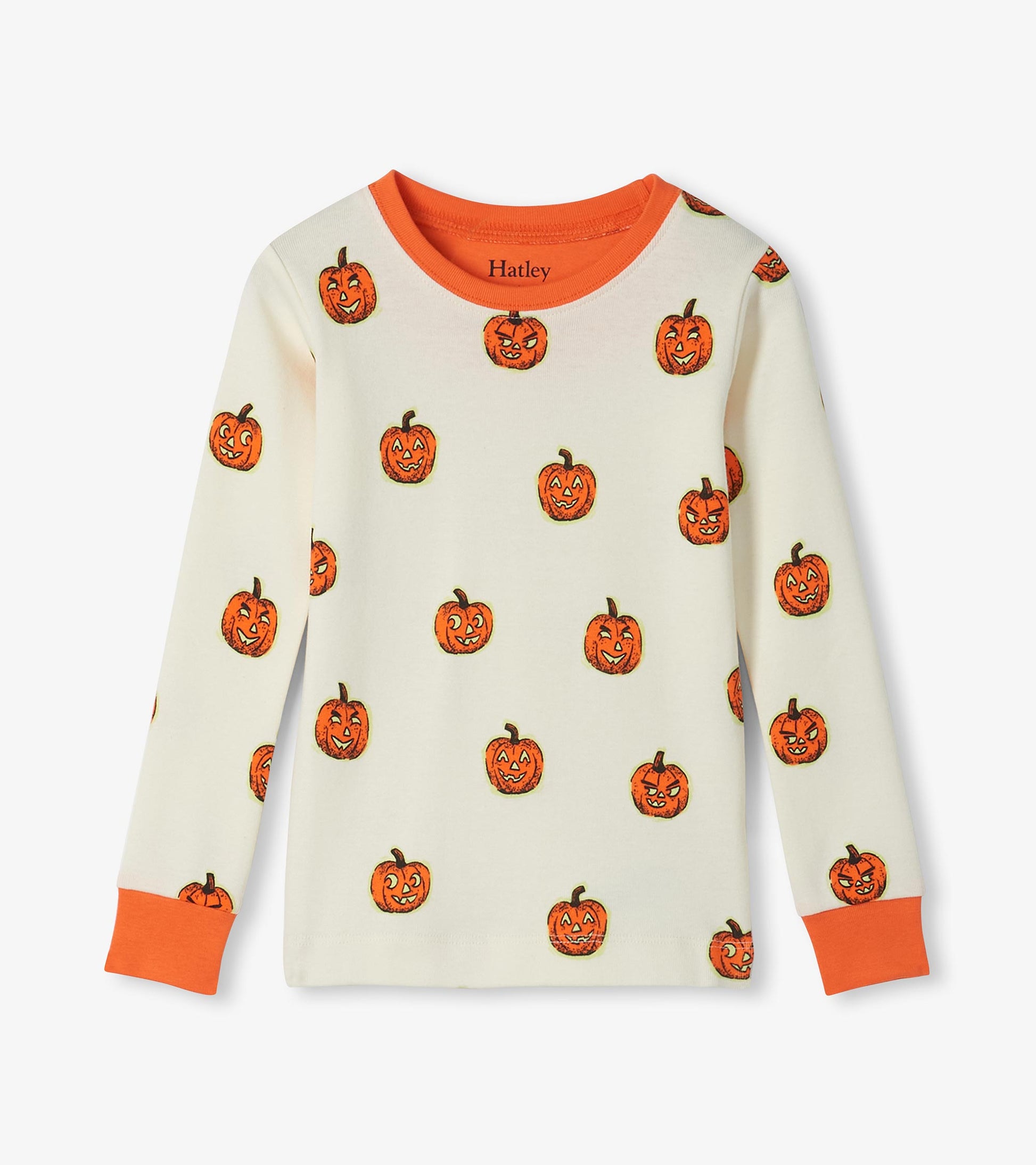 Kids pajama top in cream with orange jack-o'-lantern print and orange neck and sleeve cuffs