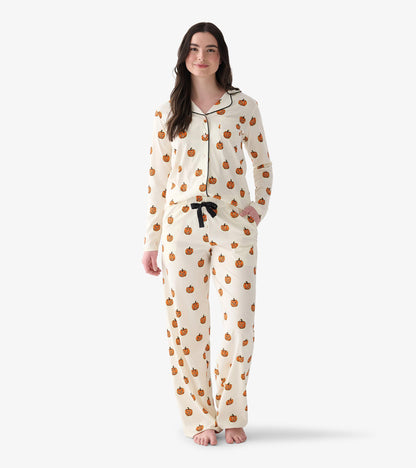 Women's cream two-piece pajamas with orange jack-o'-lantern print, black piping, and black drawstring
