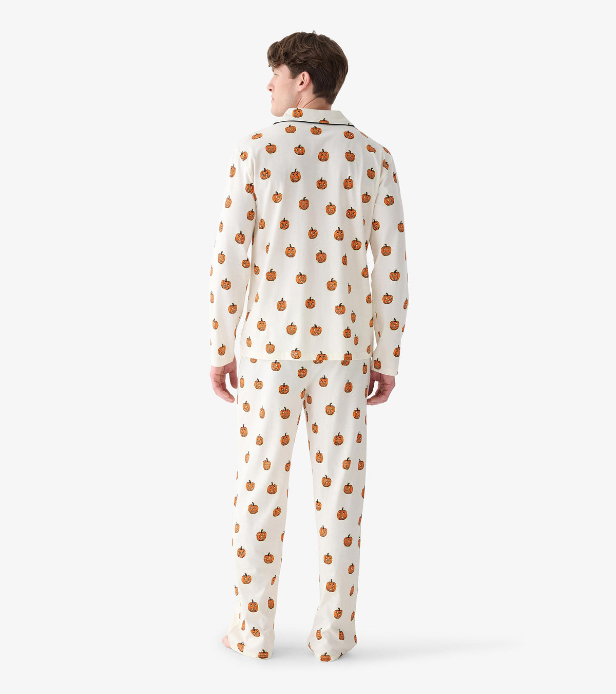 Back view of men's cream pajama set with allover orange pumpkin print and long straight-leg pants