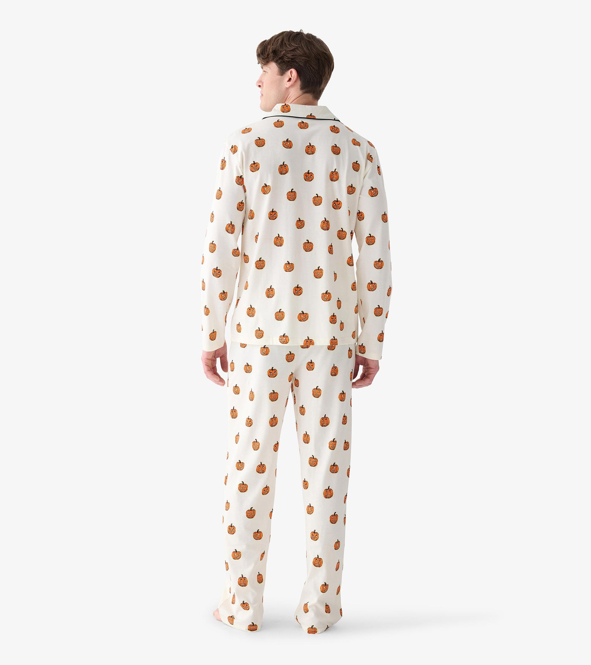 Back view of men's cream pajama set with allover orange pumpkin print and long straight-leg pants