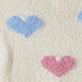 Blue heart and pink heart on cream textured background