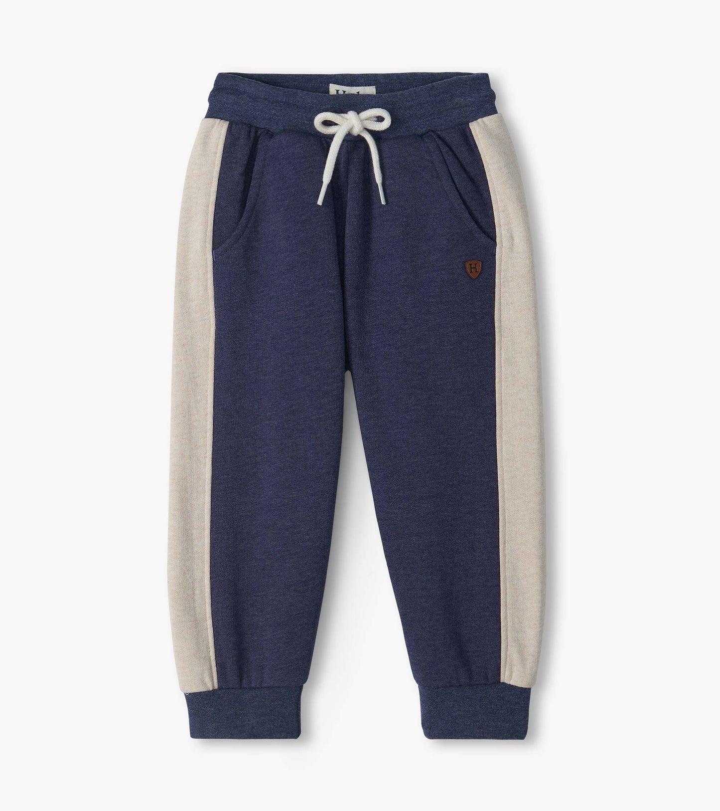 Front view of blue melange track pants with oatmeal side panels, drawcord waist, pockets, and ribbed cuffs