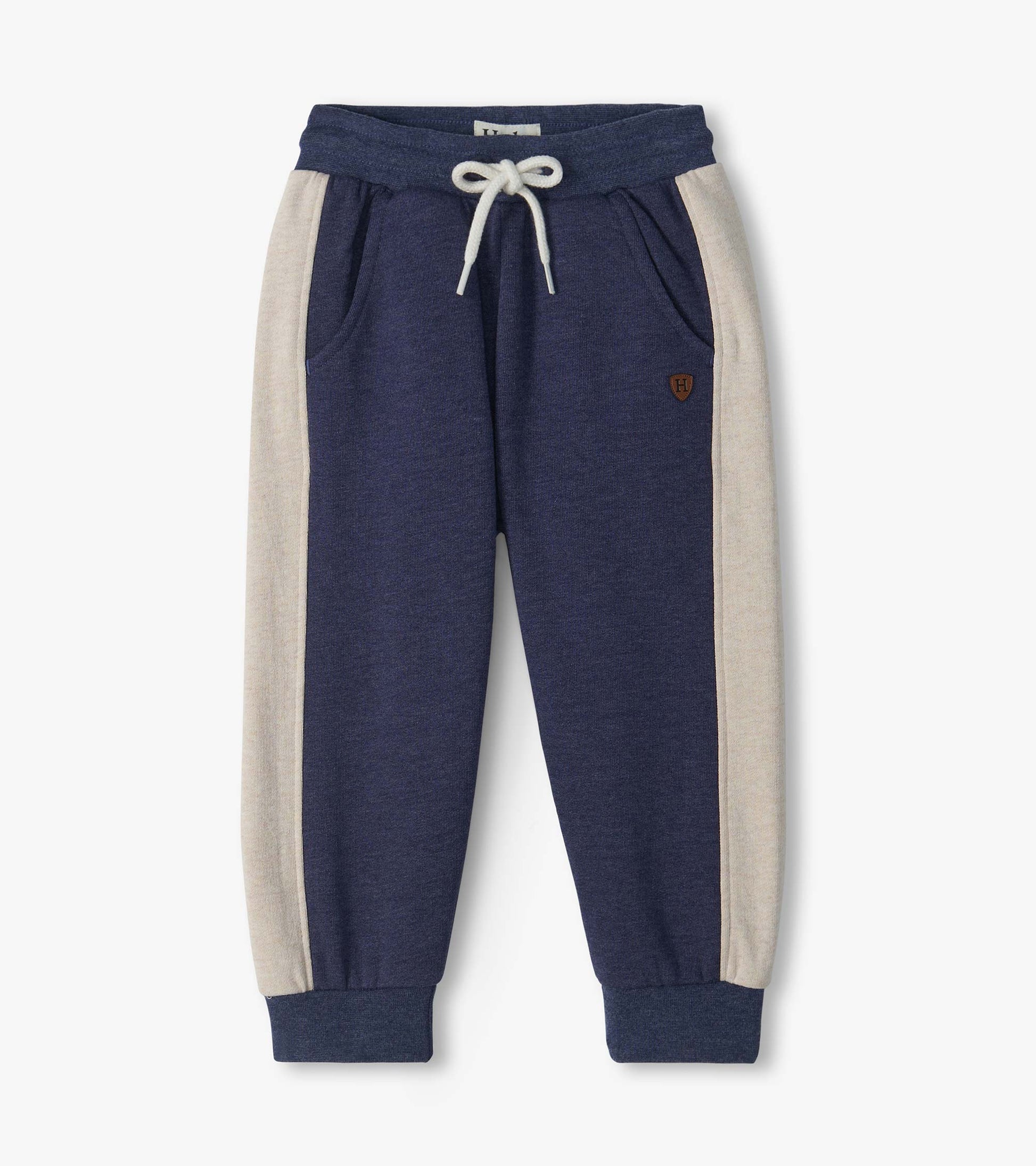 Front view of blue melange track pants with oatmeal side panels, drawcord waist, pockets, and ribbed cuffs