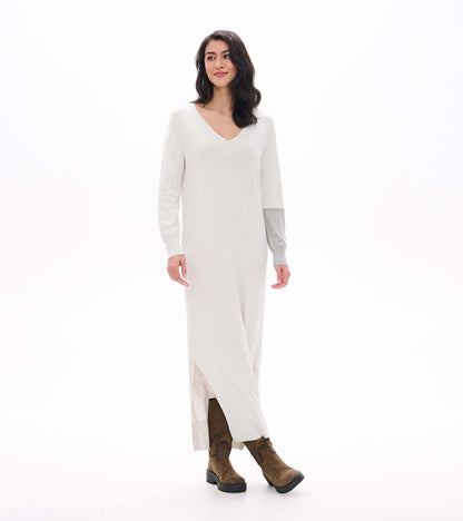 Three-quarter front view of pale grey melange maxi sweater dress with side slit and contrast sleeve detail