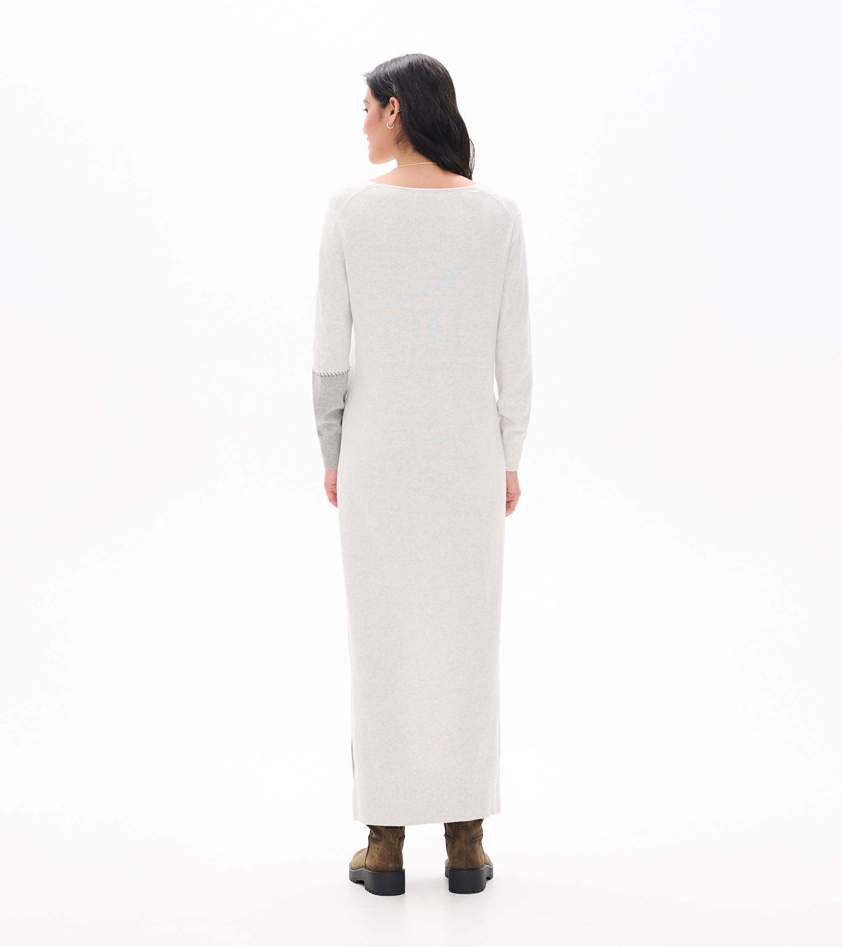 Back view of pale grey melange maxi sweater dress with long sleeves and contrast right sleeve detail