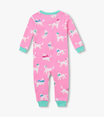 Back view of pink infant coverall with white poodle print, teal neckline and cuffs, and long sleeves