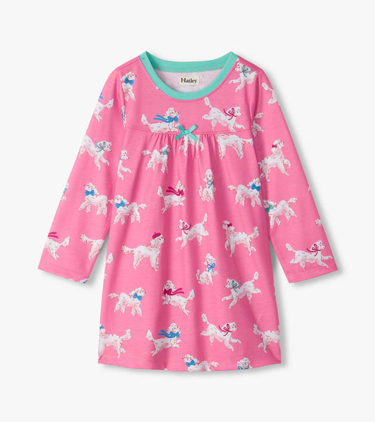 Pink long-sleeve nightdress with white poodle print, aqua neckline, and small bow at the gathered waist