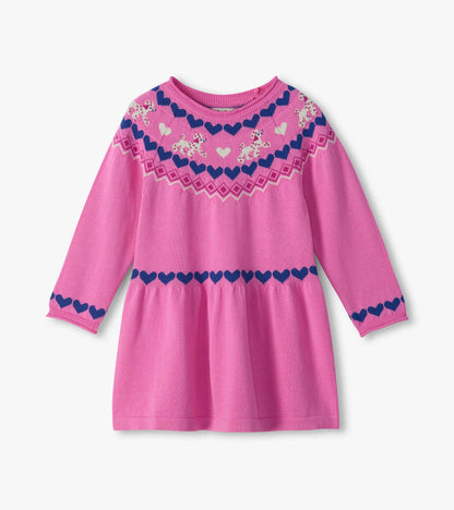 Front view of bright pink sweater dress with long sleeves, gathered skirt, navy hearts and cream puppy yoke