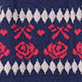 Blue and red knit pattern with white diamond shapes