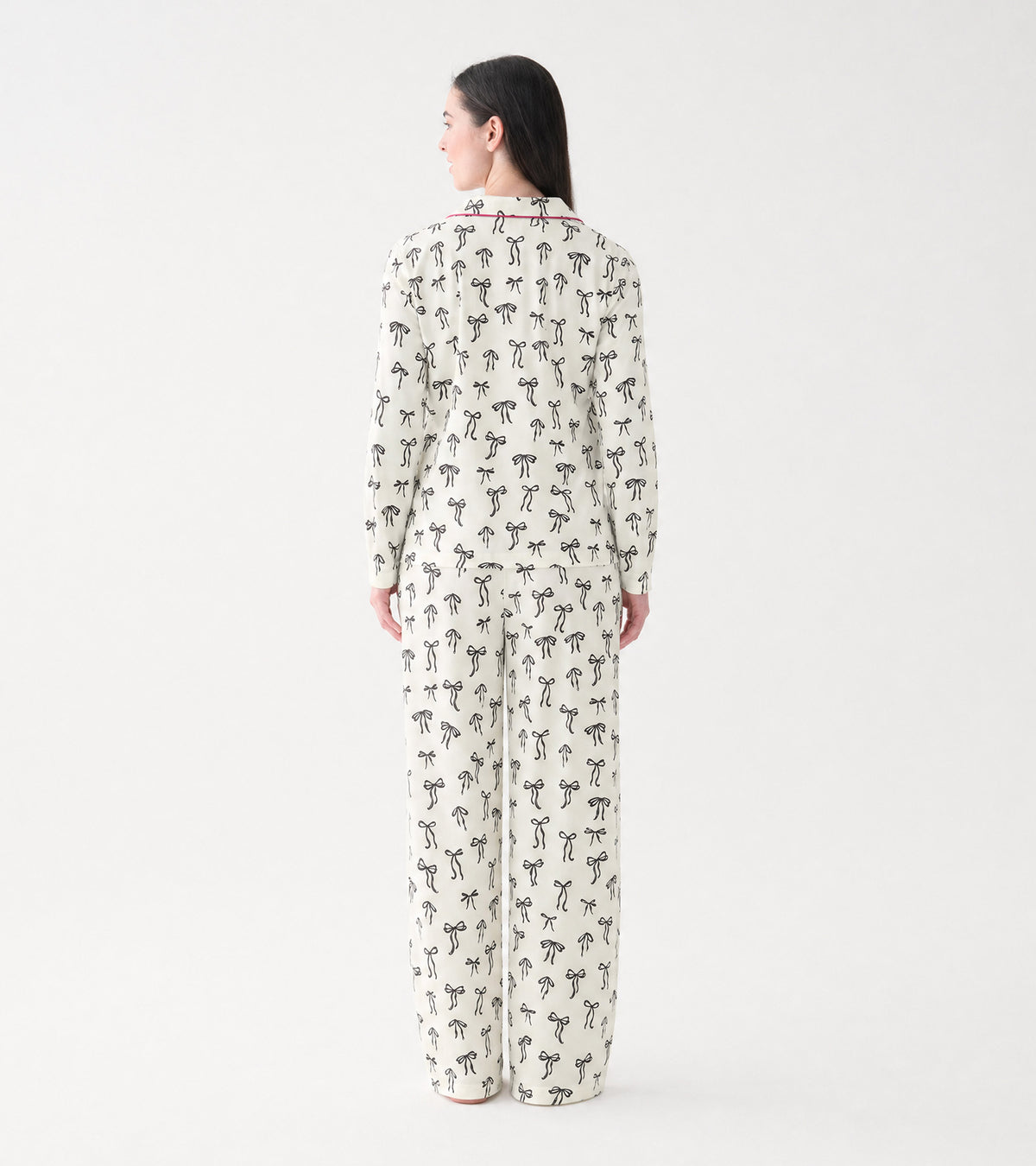 Back view of cream ribbon bow print pajama set with long sleeves and straight leg pants