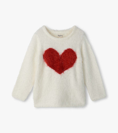 Cream fuzzy girls sweater with long sleeves and a large red heart on the front