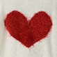 Red heart on white fabric