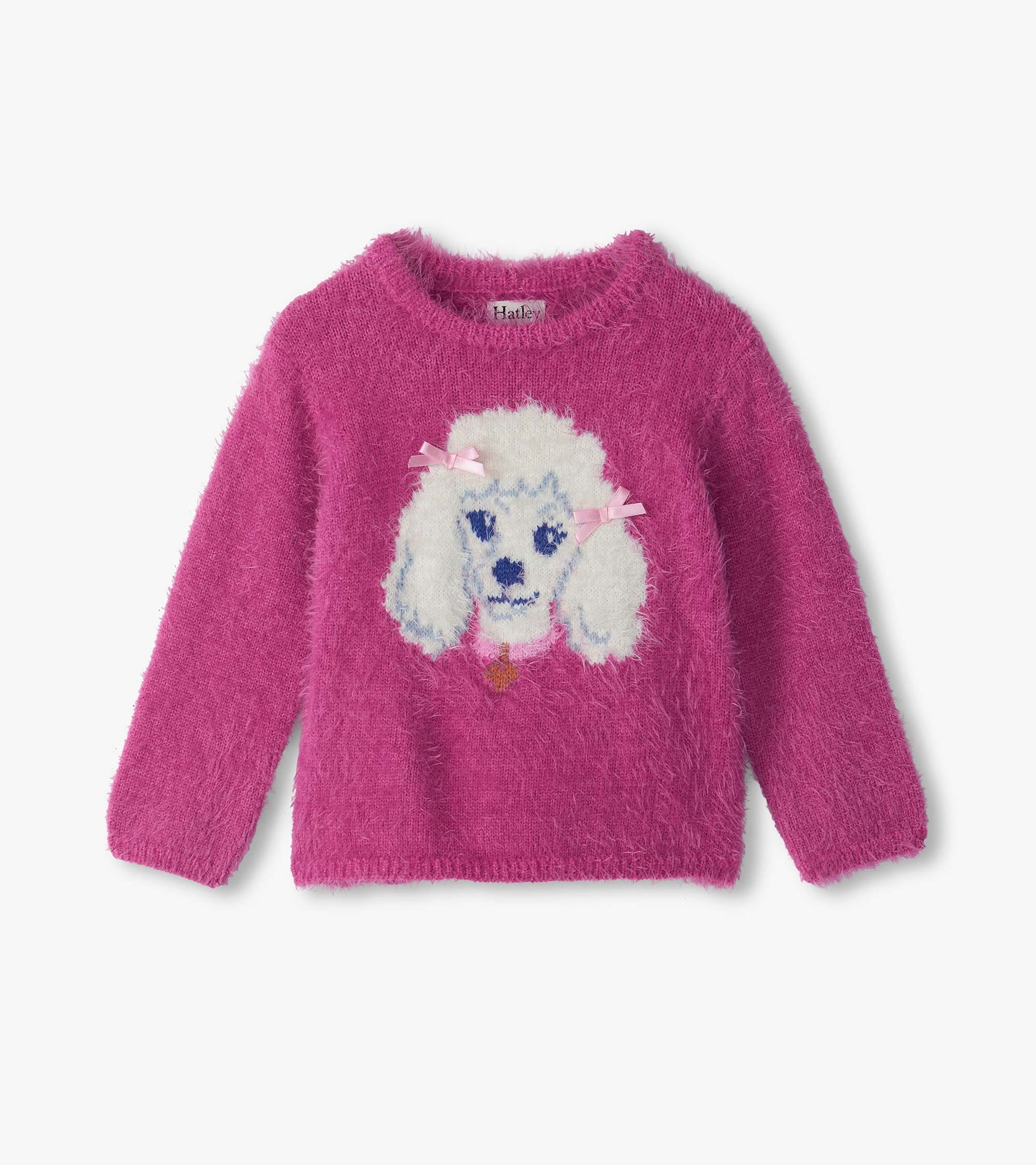 Bright pink fuzzy sweater with a white poodle graphic and pink bows on the front