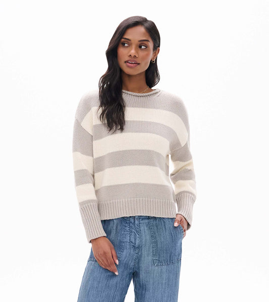 Model wearing stone and cream striped rolled collar sweater, front view