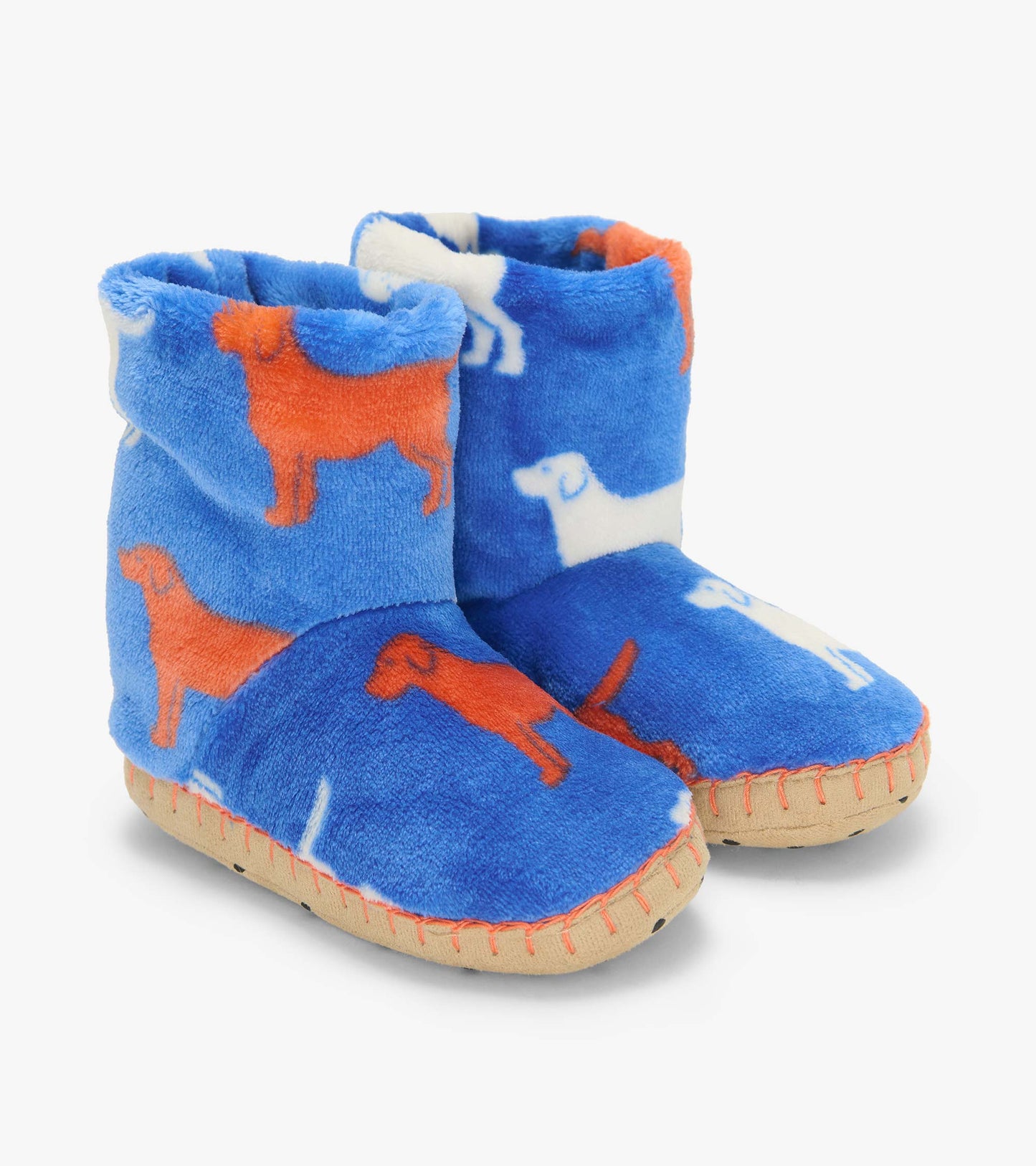 Pair of blue slipper boots with orange and white dog silhouettes and tan soles, front three-quarter view