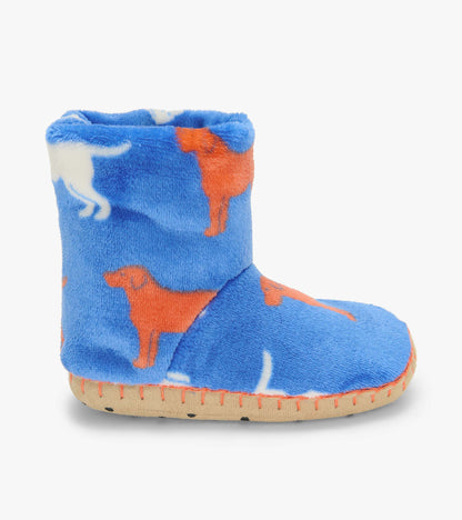 Side view of blue slipper boot with orange and white dog silhouette print and tan sole