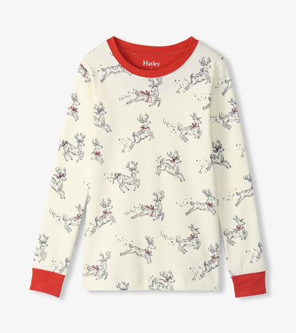 Cream long sleeve pajama top with leaping reindeer print and red neckline and cuffs