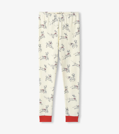 Cream pajama pants with leaping reindeer print and red ankle cuffs