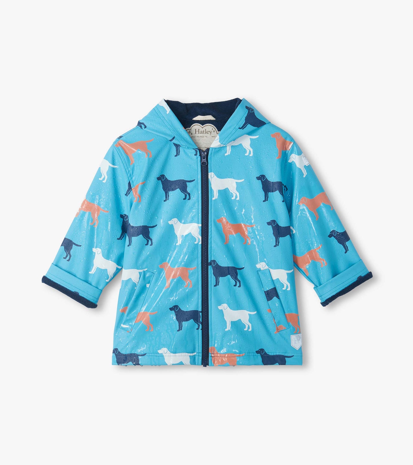 Front view of blue hooded rain coat with wet surface and dog print changing to orange, white, and navy