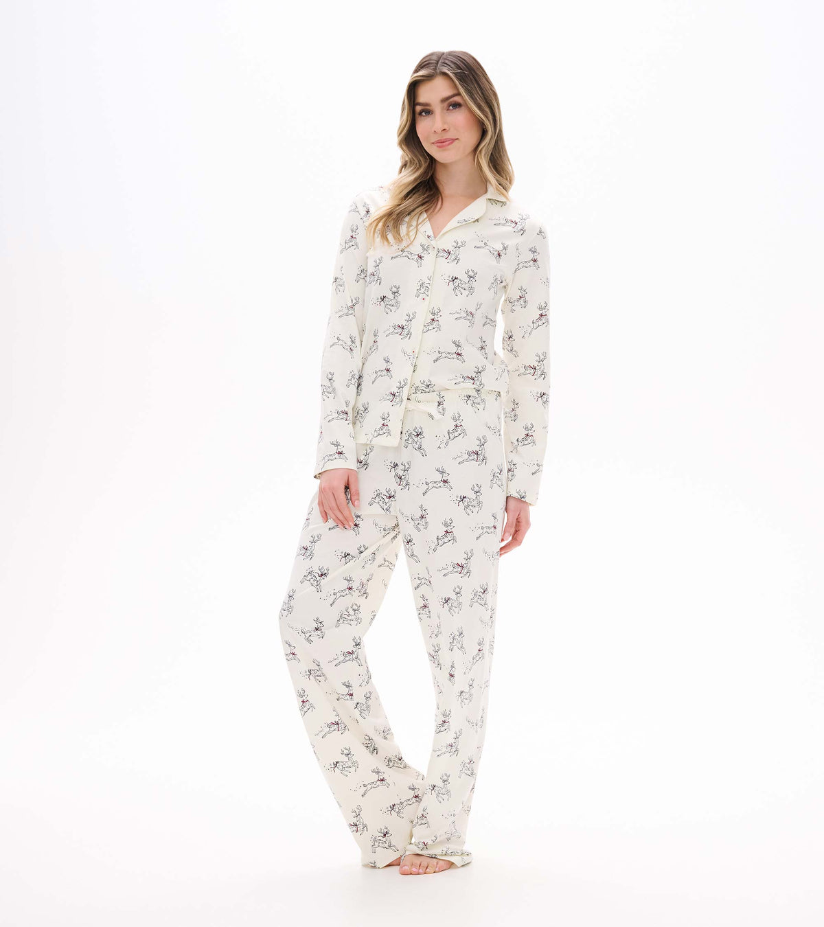 Front view of ivory button-up pajama set with long sleeves and allover prancing reindeer print