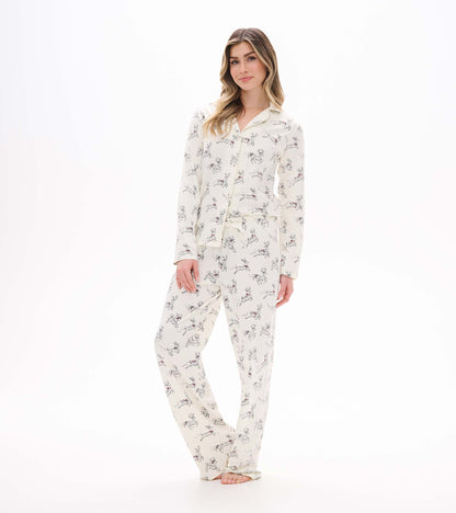 Front view of ivory button-up pajama set with long sleeves and allover prancing reindeer print
