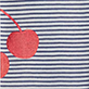 Red apple on navy and white striped fabric
