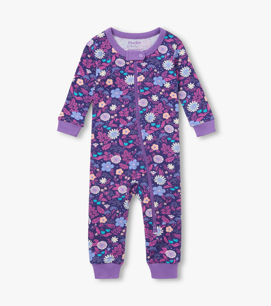 Front view of infant coverall with purple floral print, purple trim, and full zip closure