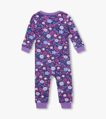 Back view of infant coverall with purple floral print and purple cuffs