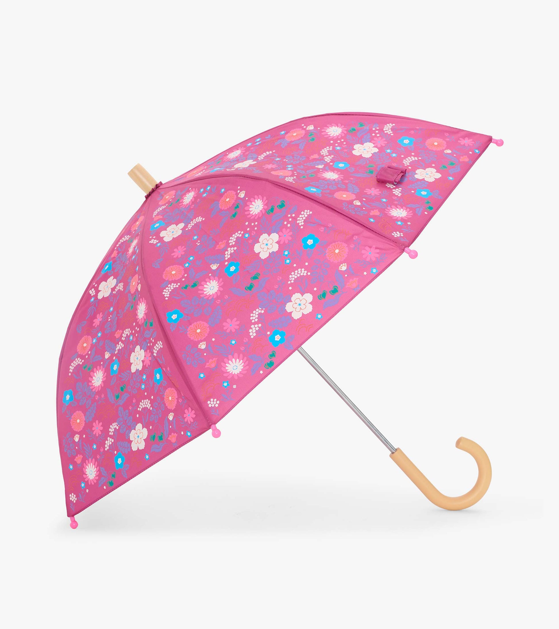 Open pink kids umbrella with multicolor tiny flower print and curved light wood-tone handle