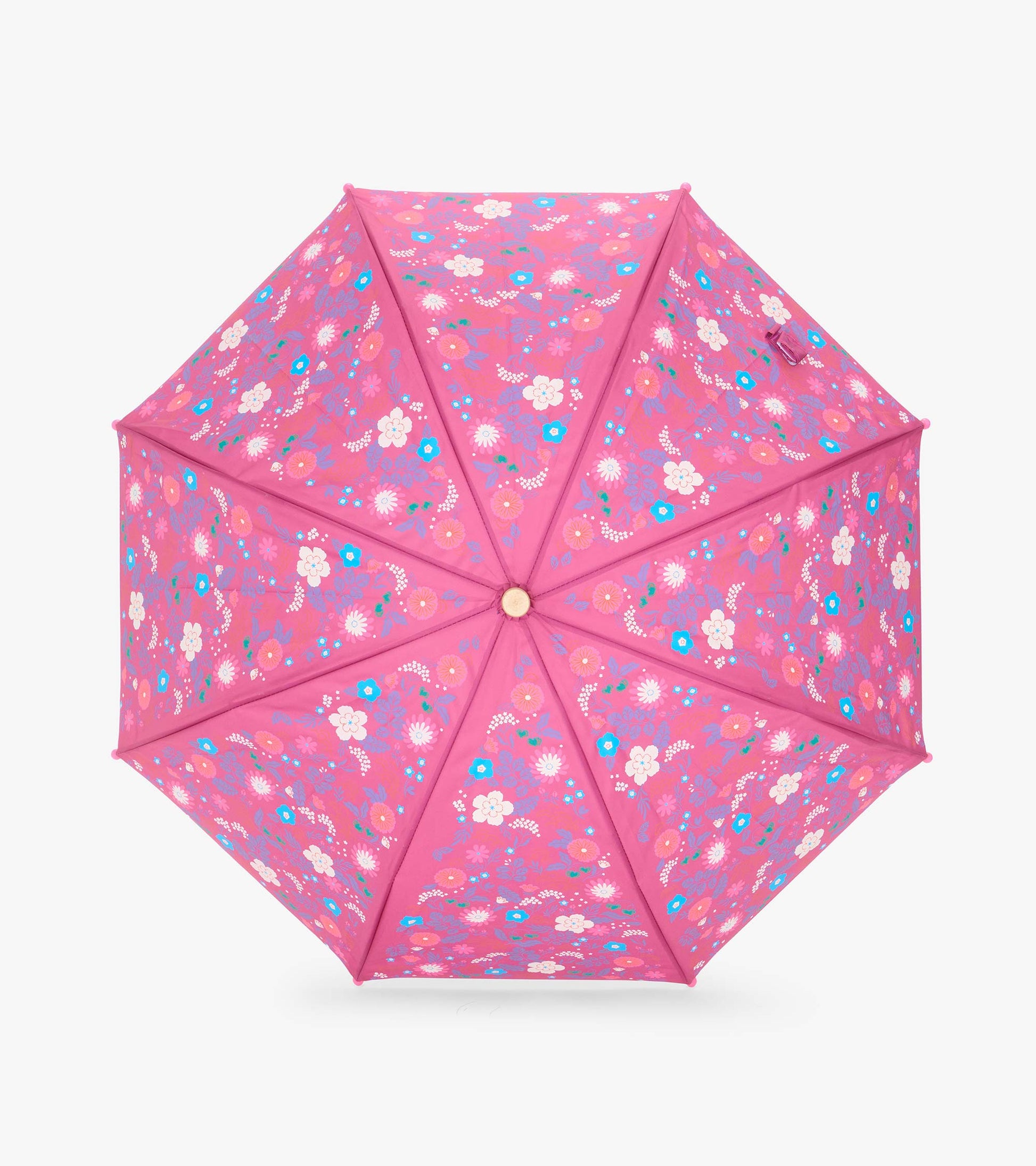 Top view of open pink umbrella with tiny multicolor floral print