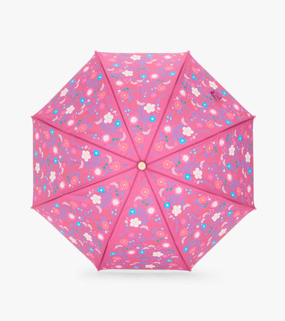 Top view of open pink umbrella with tiny multicolor floral print