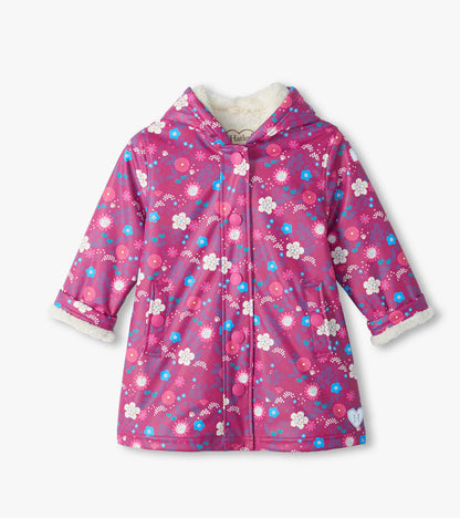 Front view of pink hooded jacket with white, blue, and pink tiny flower print and snap front