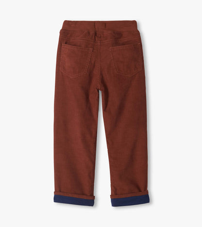 Back view of tortoise brown pull-on pants with two back patch pockets and rolled cuffs