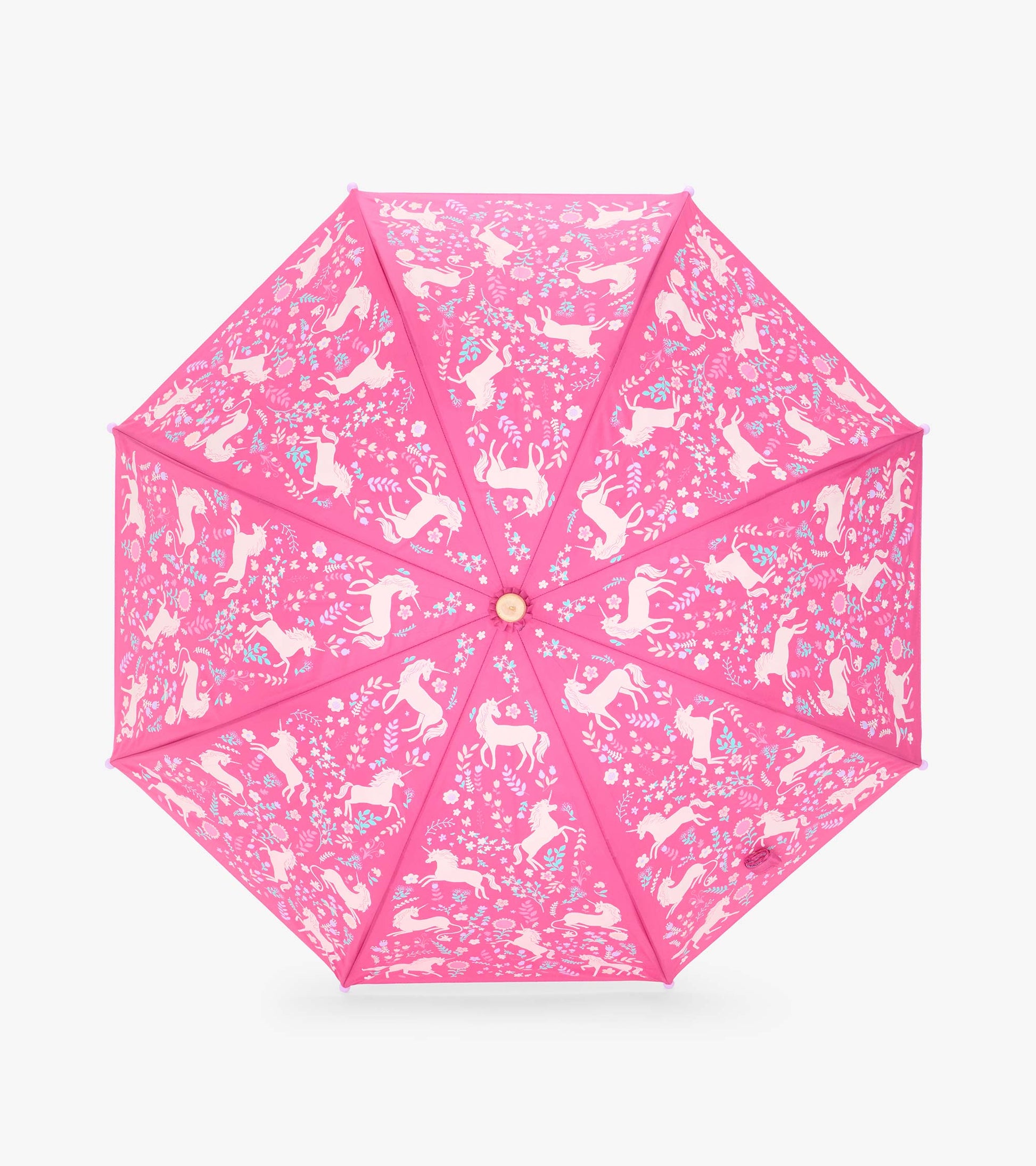 Top view of pink umbrella canopy with white unicorns and scattered flowers