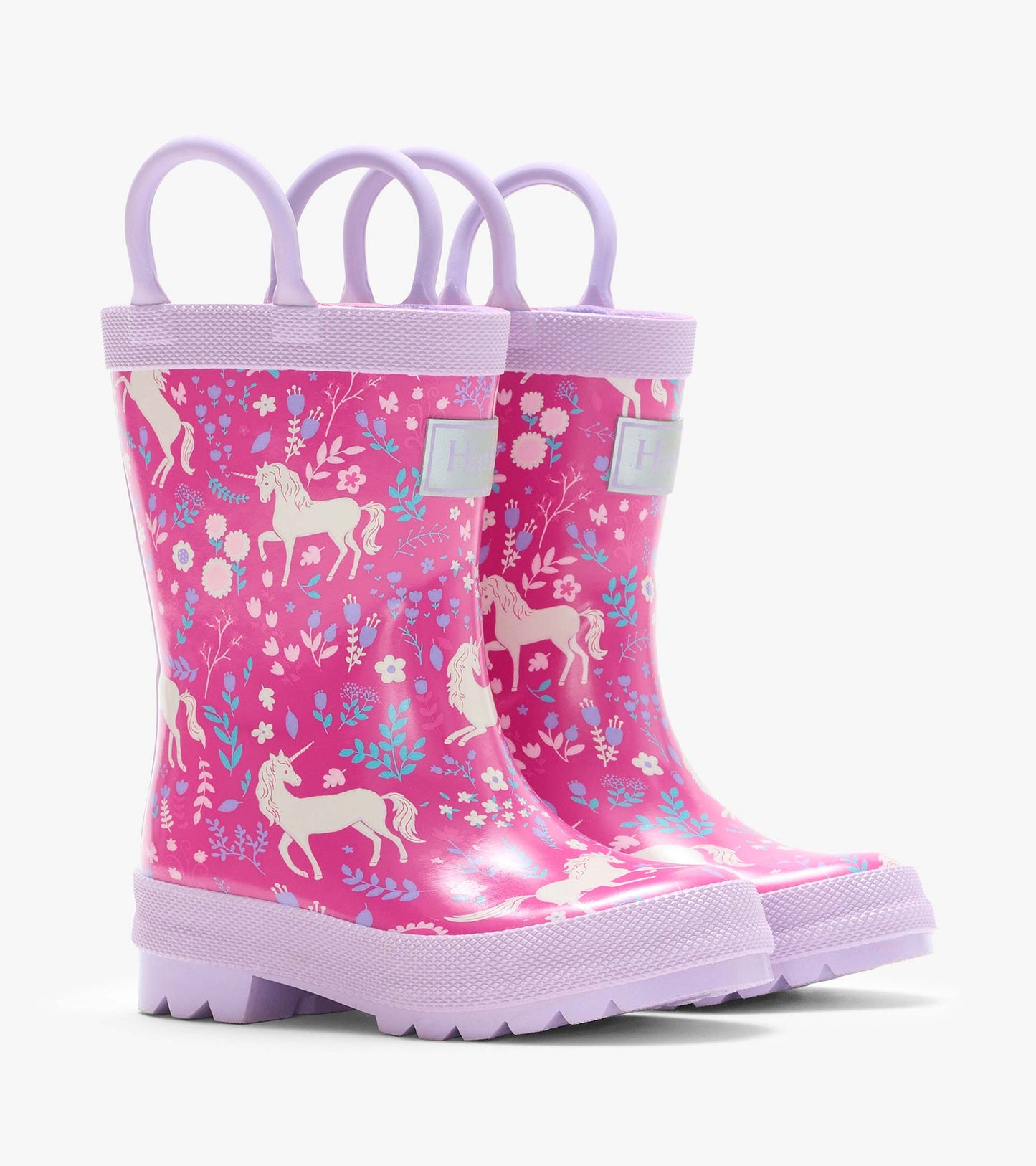 Pair of pink rain boots with lilac handles, unicorn and floral print, shown at a front angle