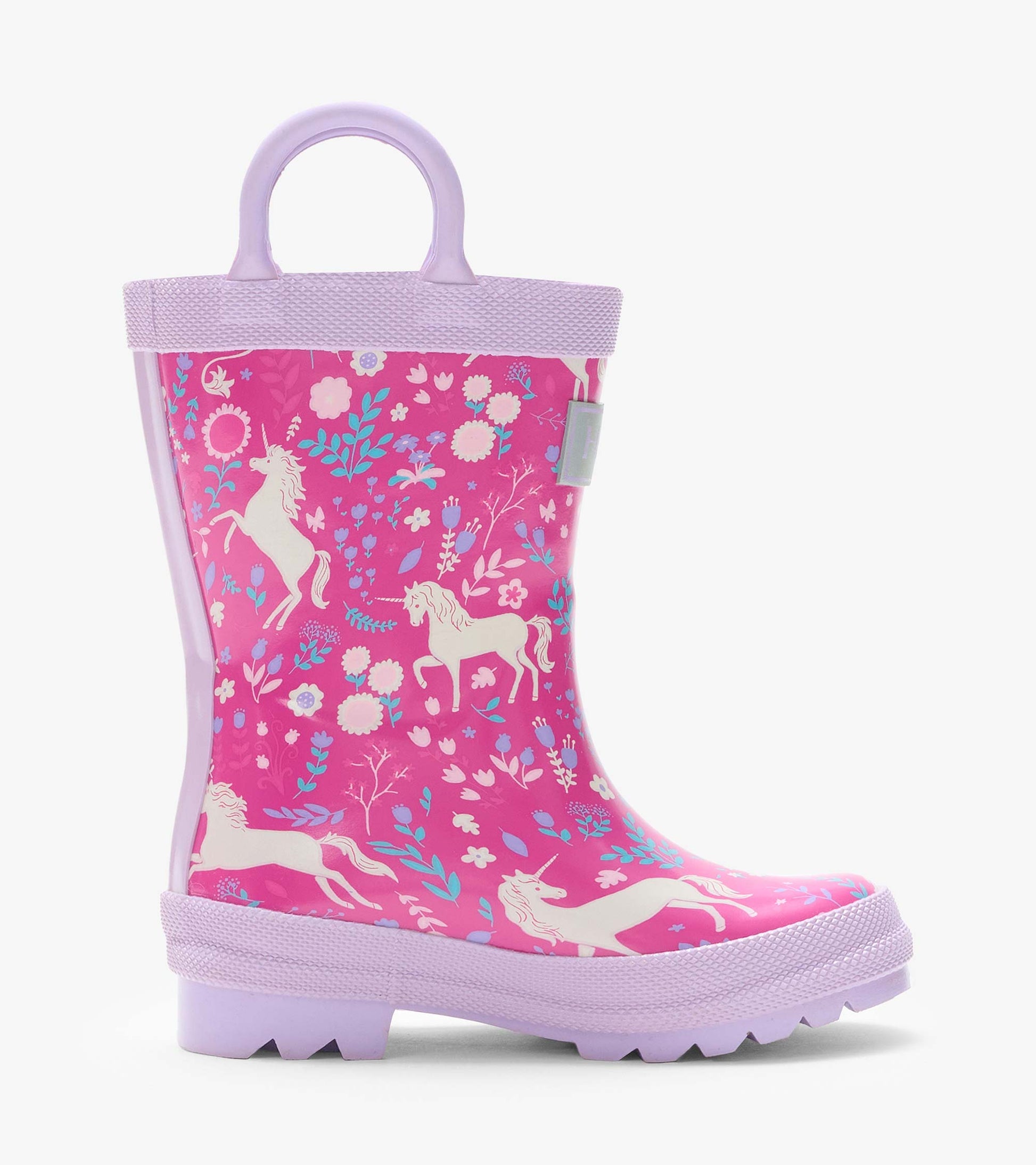 Side view of a pink rain boot with lilac handle and sole, featuring unicorn and floral print