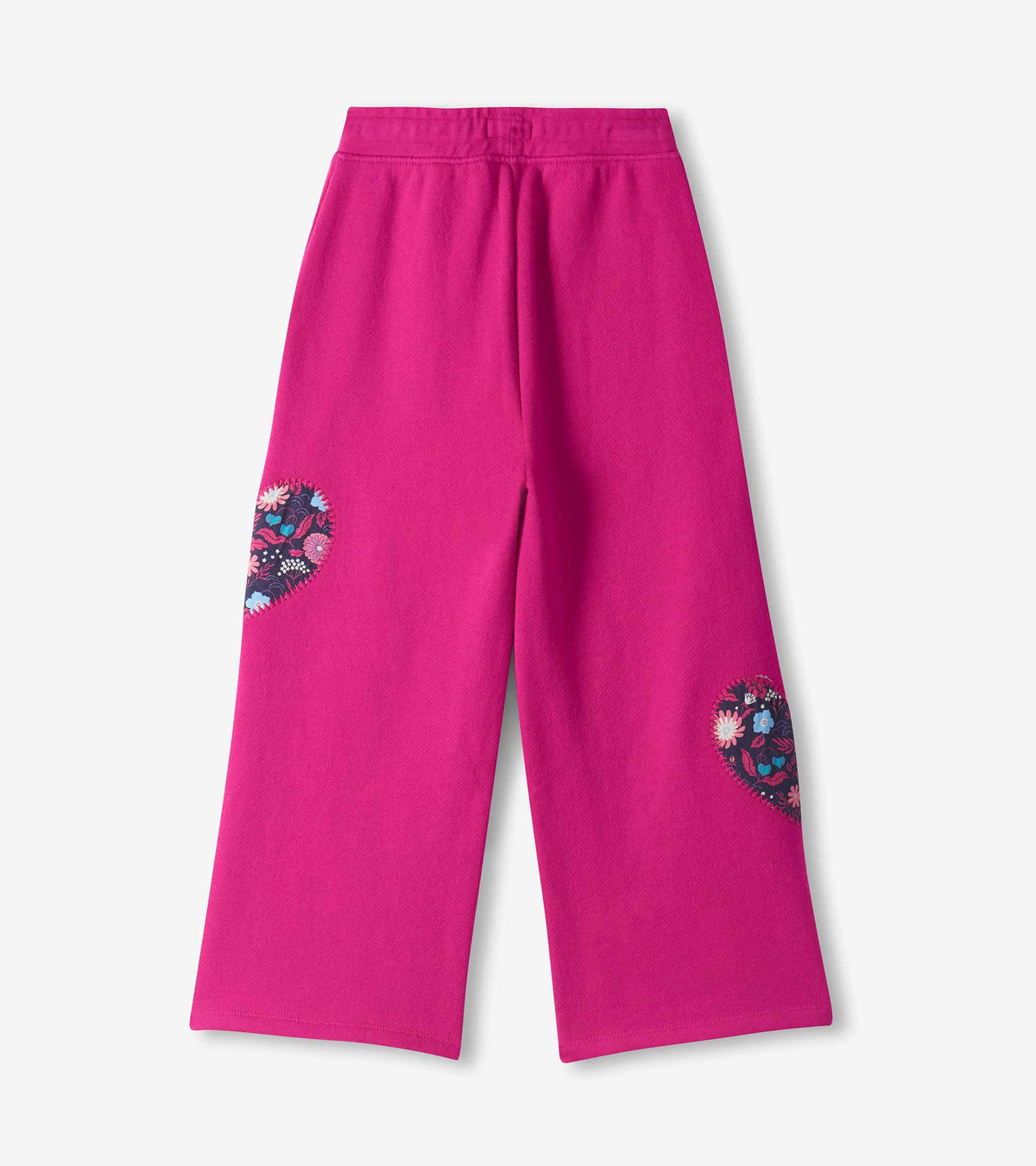 Back view of berry pink wide leg track pants with floral heart patches on the backs of both legs