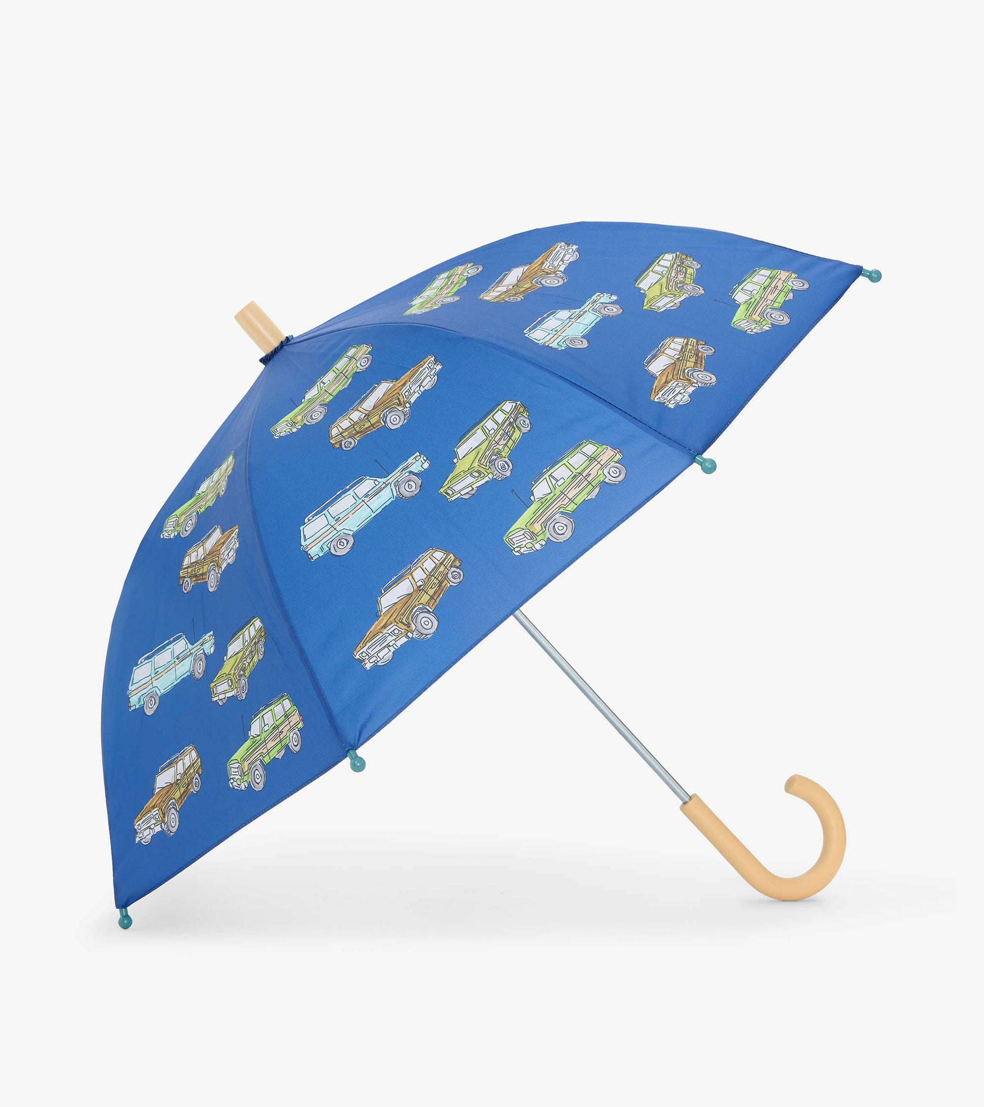 Open blue kids umbrella with vintage truck print and curved light wood-tone handle