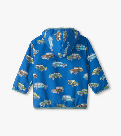 Back view of blue hooded field jacket with vintage truck print in green, brown, and light blue
