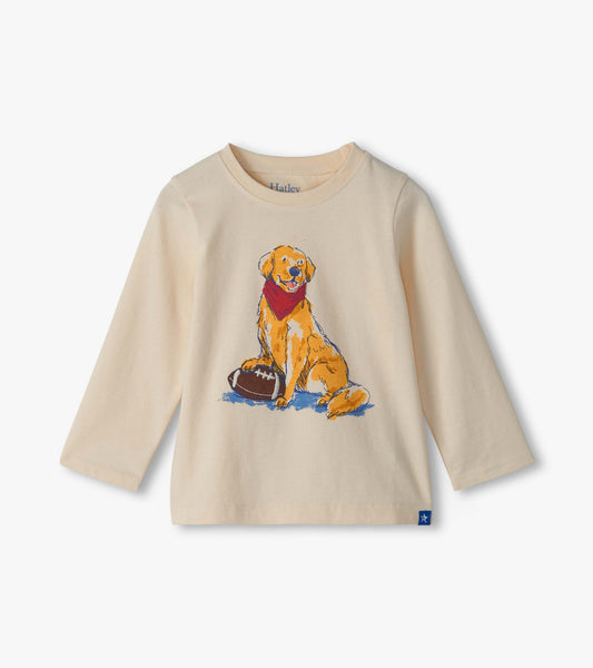 Cream long-sleeve crew neck tee with a golden lab graphic wearing a red bandana beside a football