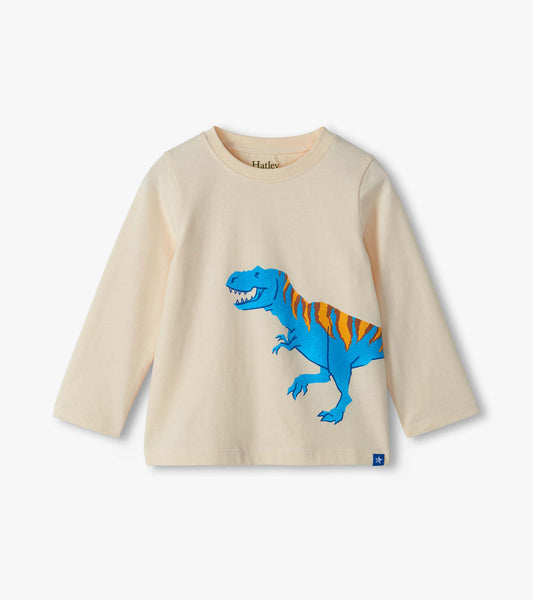 Cream long-sleeve crew neck tee with a large blue T-rex graphic on the front