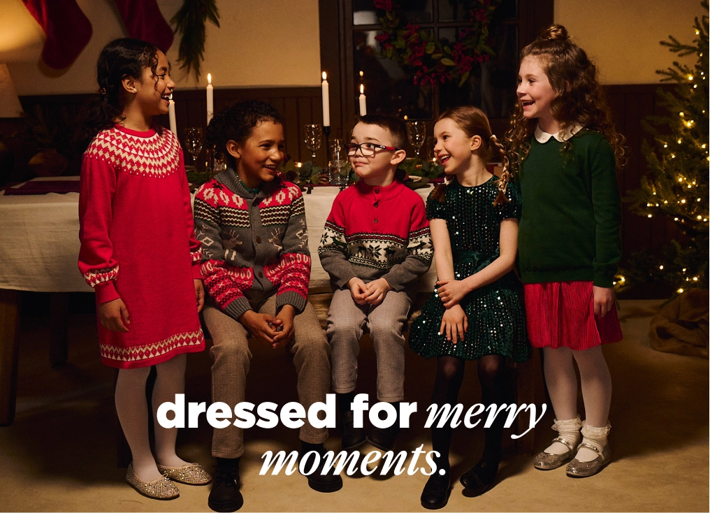 Promotes kids holiday daywear collection. With "dressed for merry moments." text.